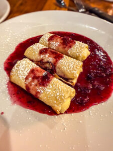 Cheese Blintz crepes with berry compote at Buffalo Breakfast Co