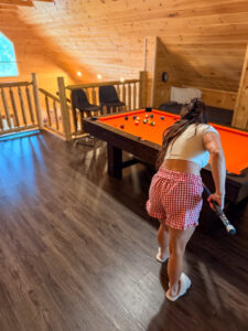 Game room at Sevierville cabin rental pool table
