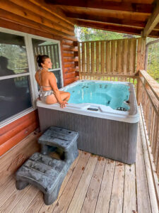 Hot tub and hammock at Sevierville cabin rental