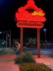Los Compadres Restaurant glowing neon sign on Route 66