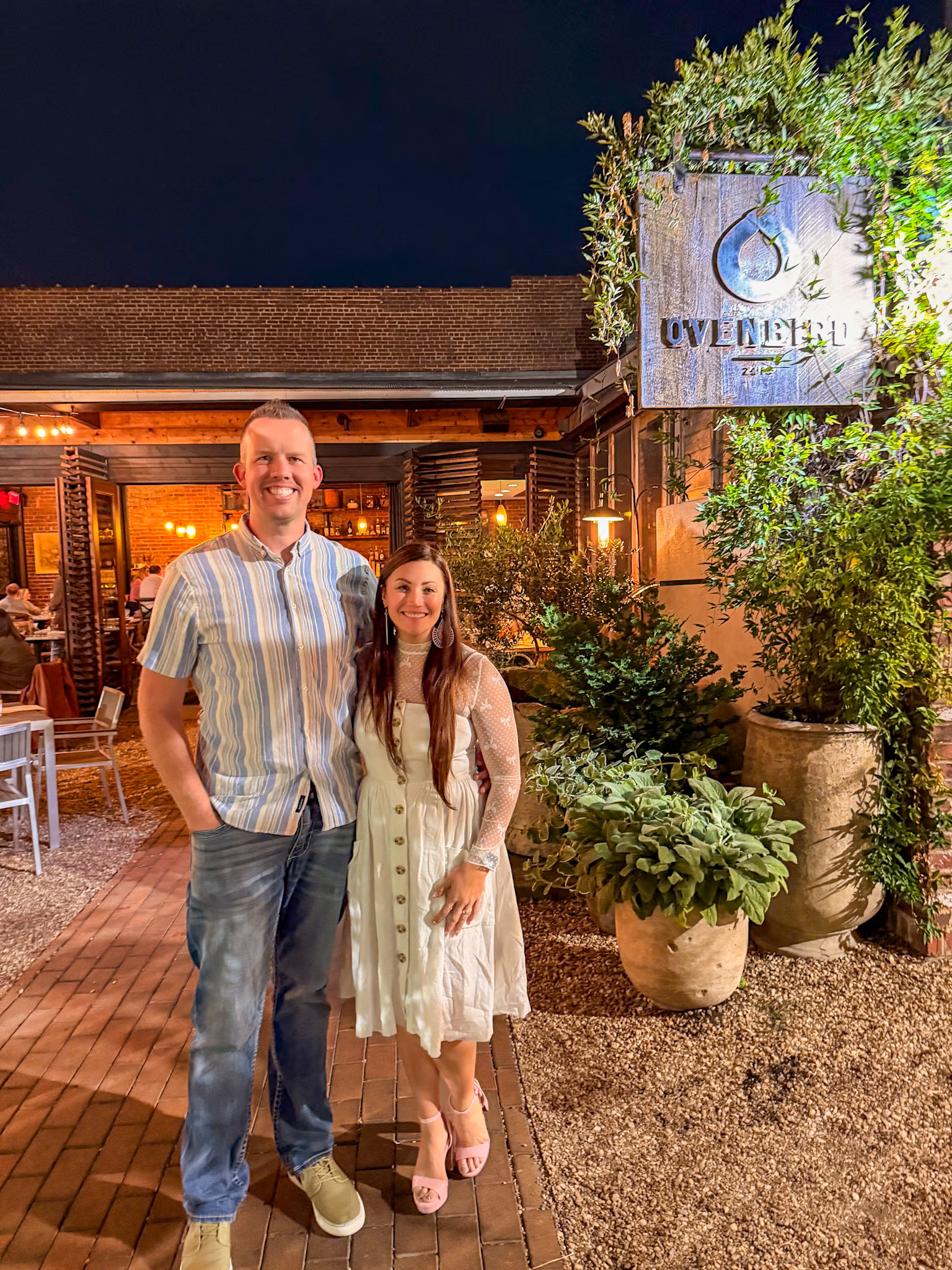 OvenBird Birmingham AL patio with string lights and fire pit