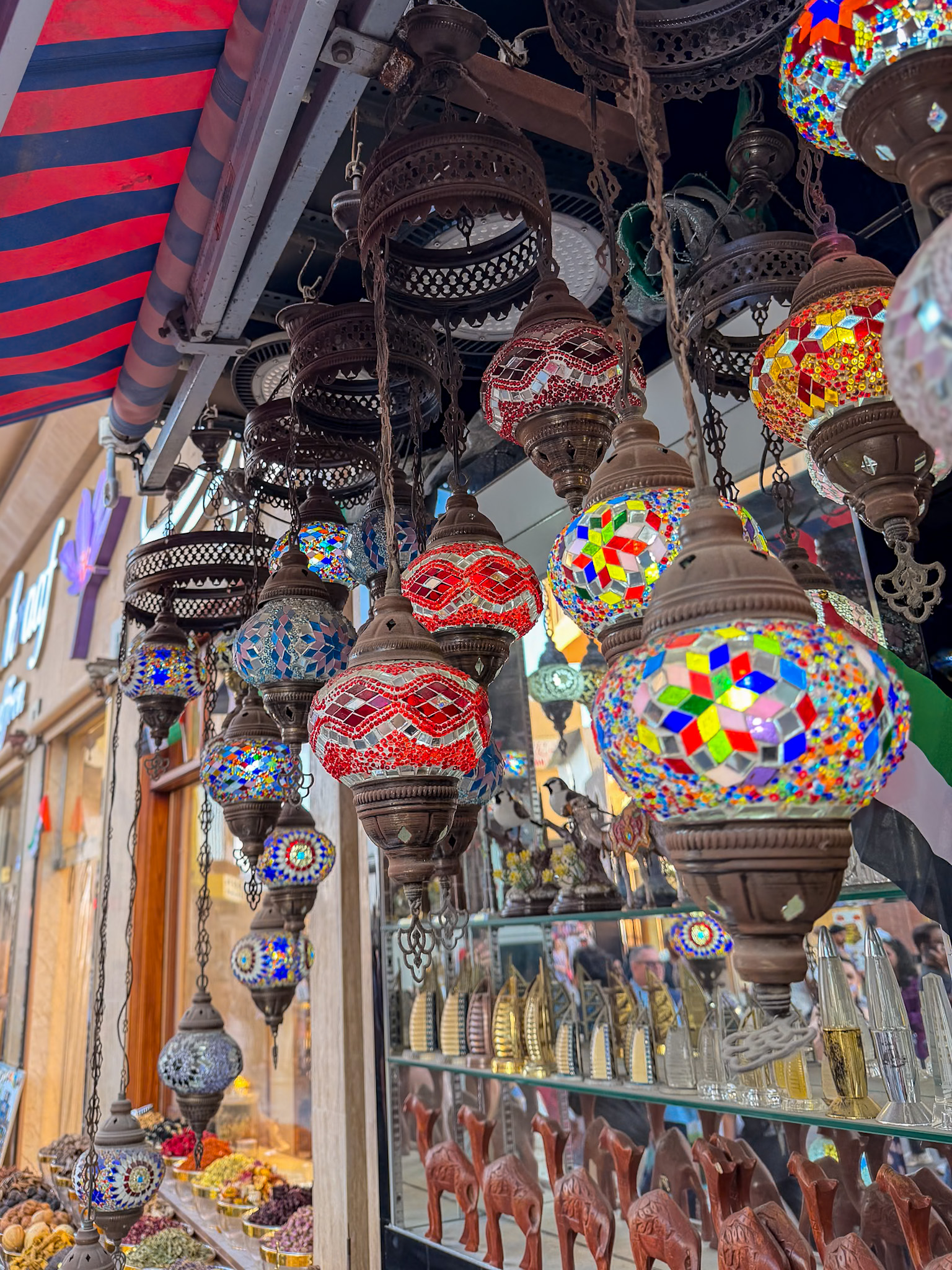 Historic buildings by Abra Ride on Dubai Creek selling souvenirs 