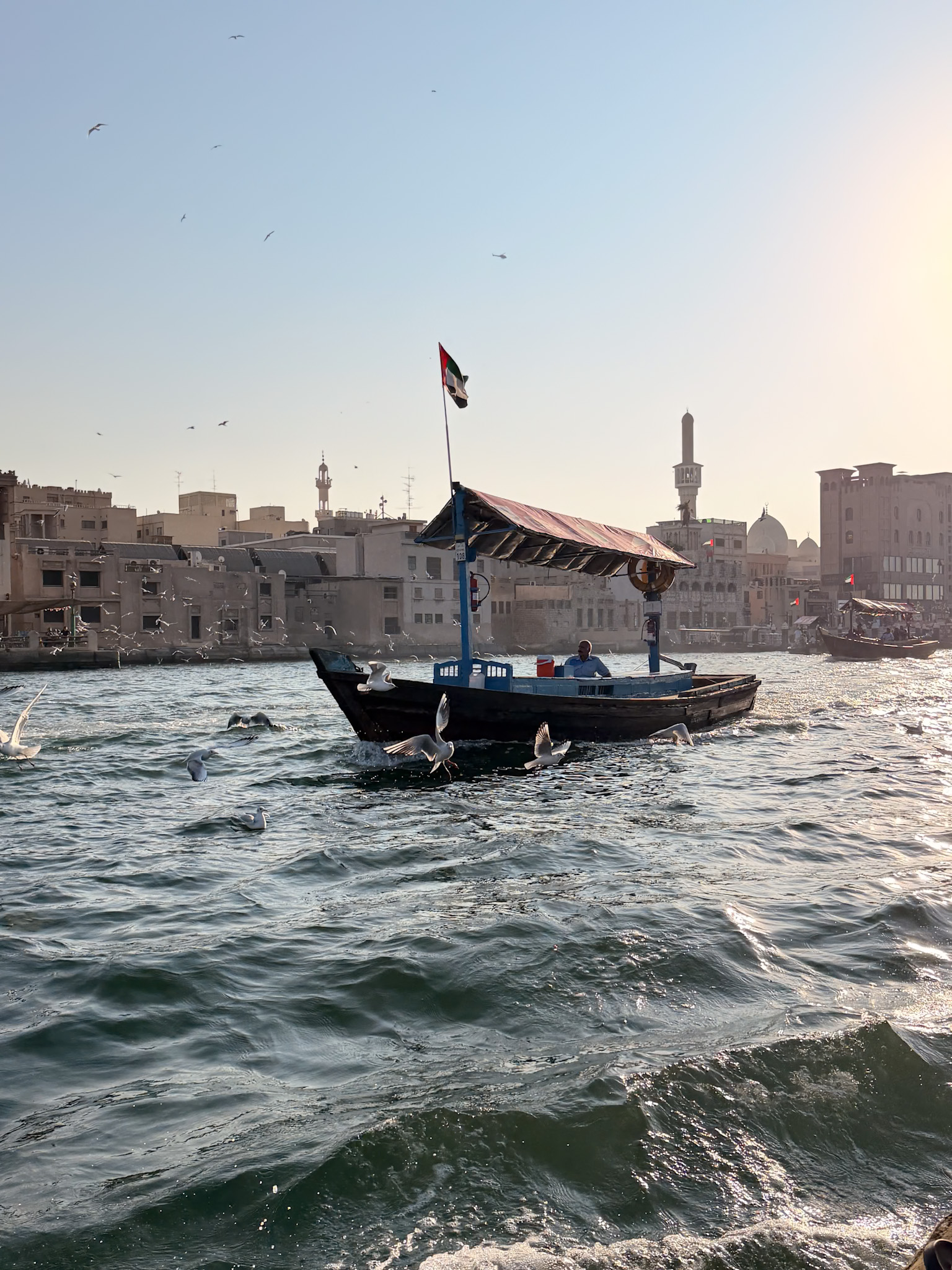 Old Dubai guide abra boats crossing Dubai Creek