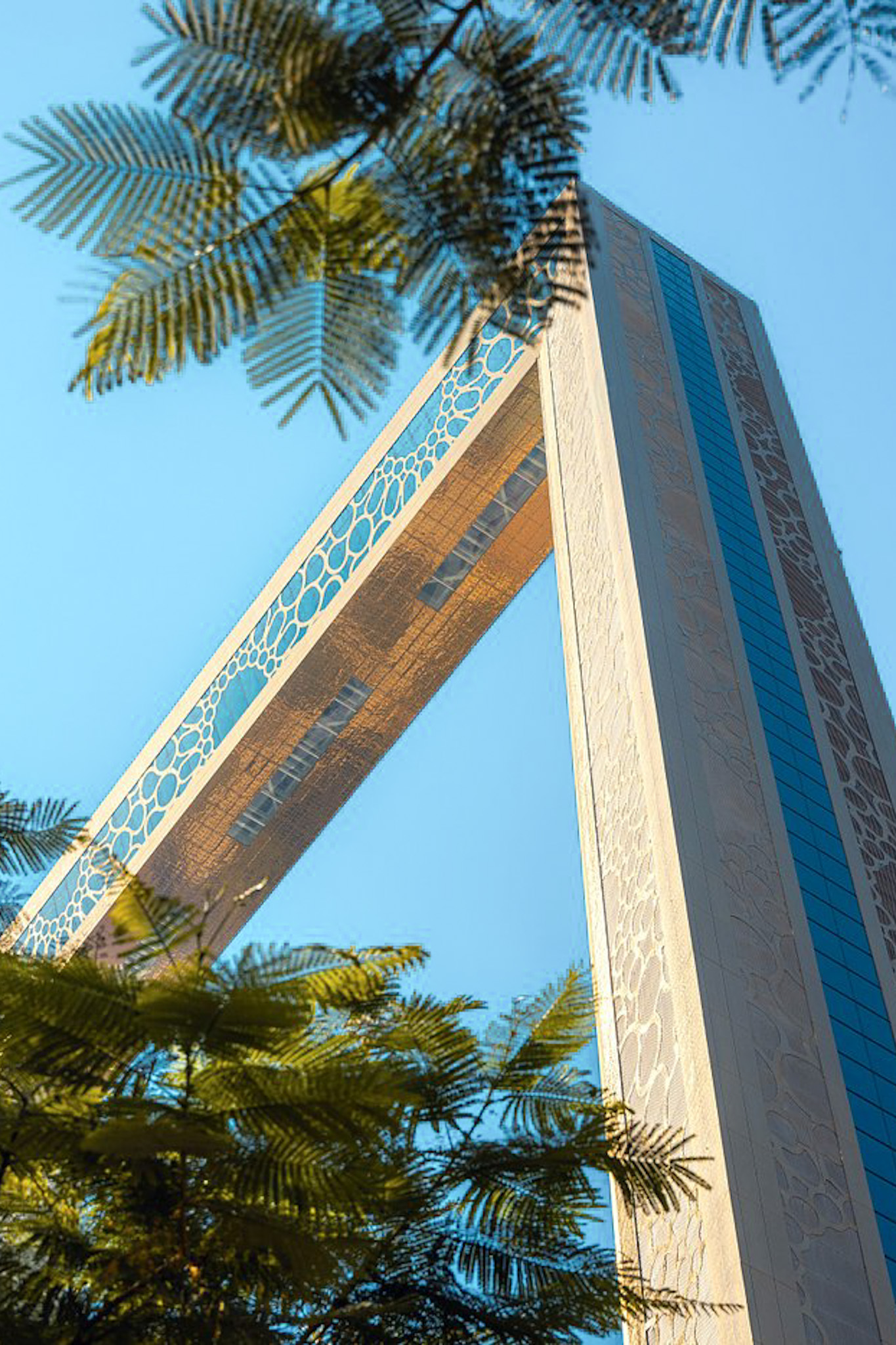 Dubai Frame guide modern Dubai skyline side
