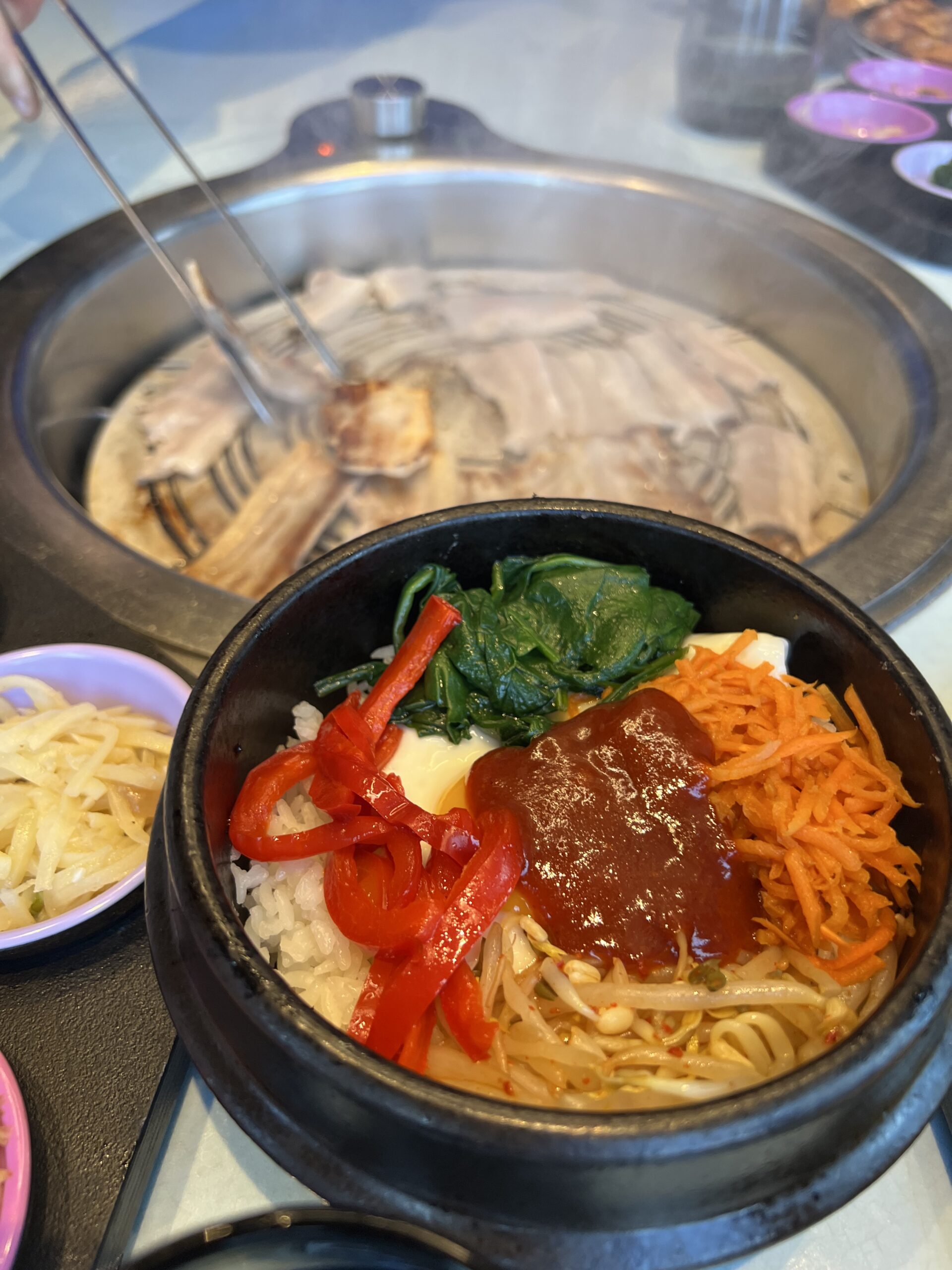 Virgin Voyages restaurant guide with Gunbae Korean BBQ grill at the table