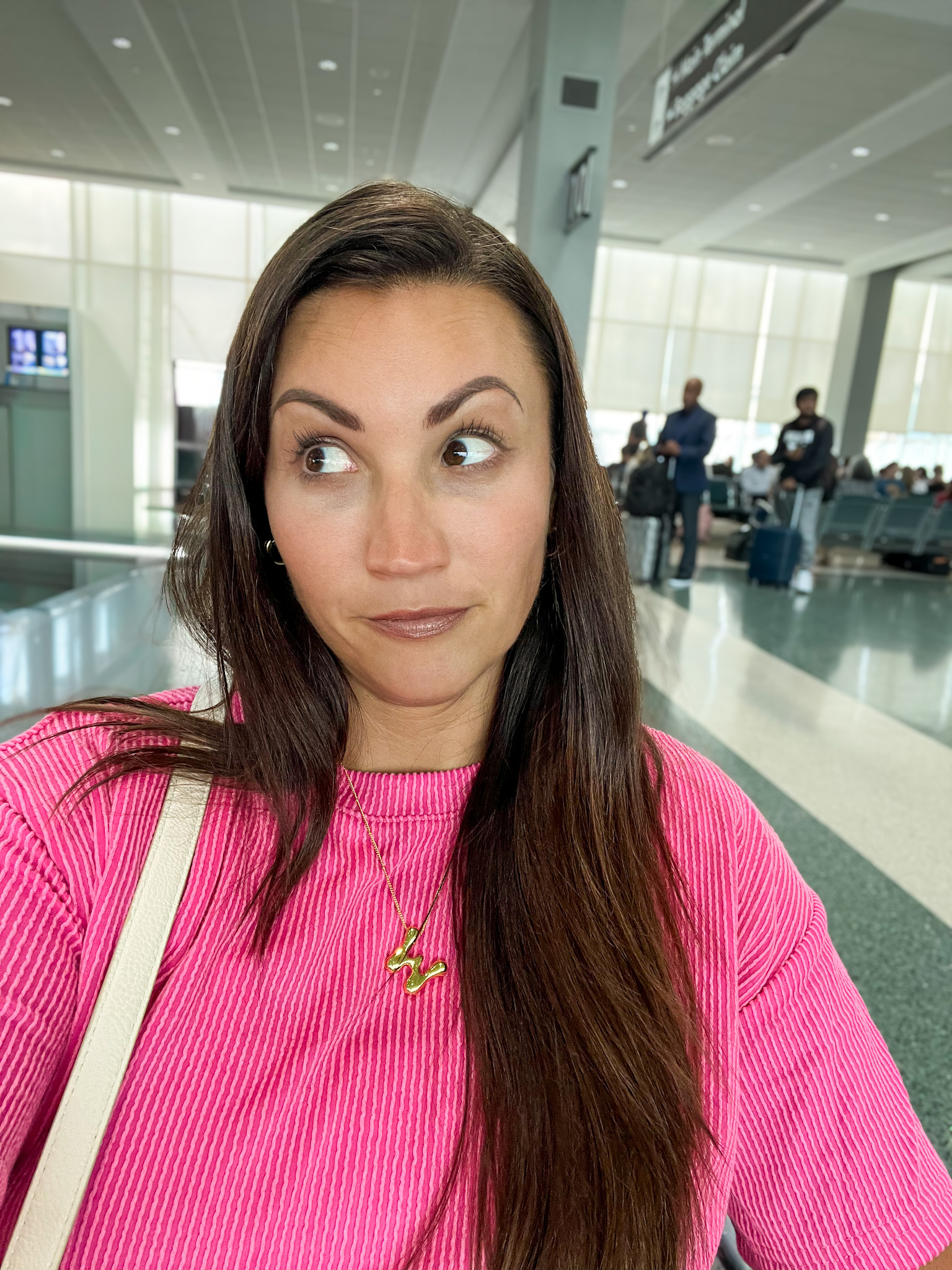 woman running through airport layover time stress