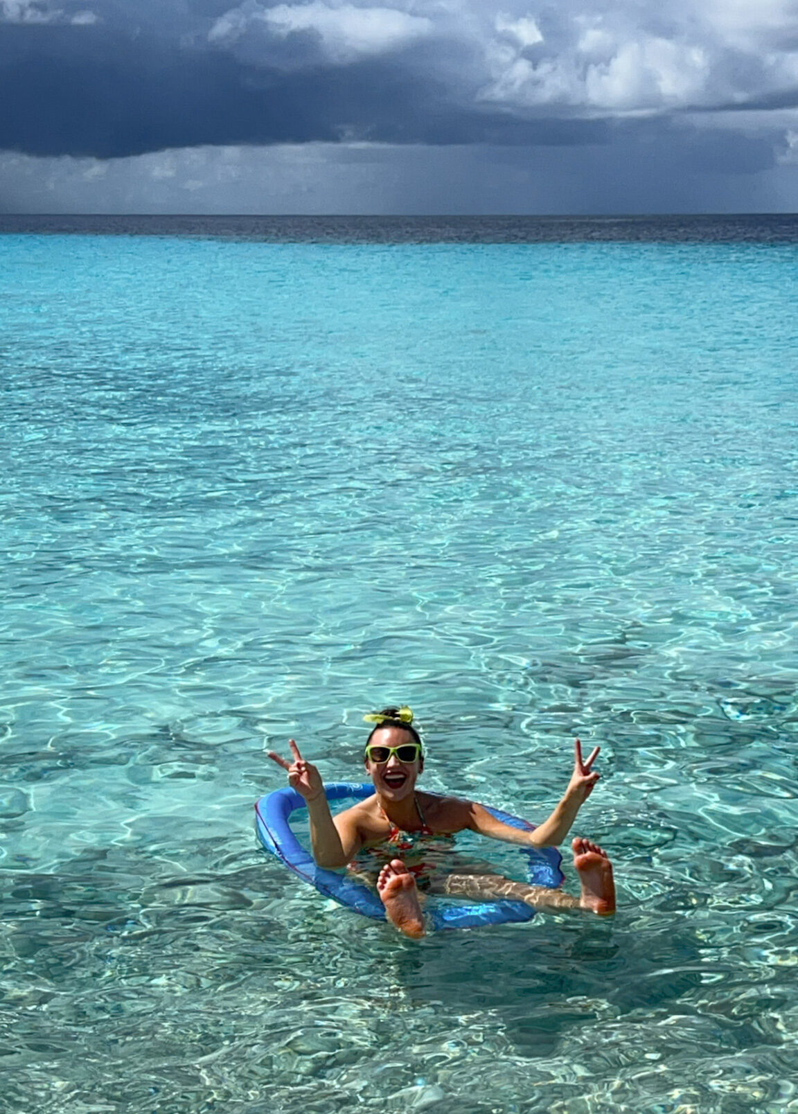 What to Pack for Curaçao float in clear blue ocean water