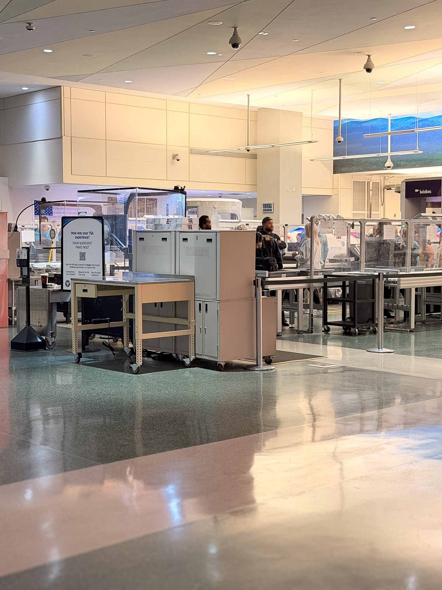 Travelers walking through security in this Knoxville Airport Guide