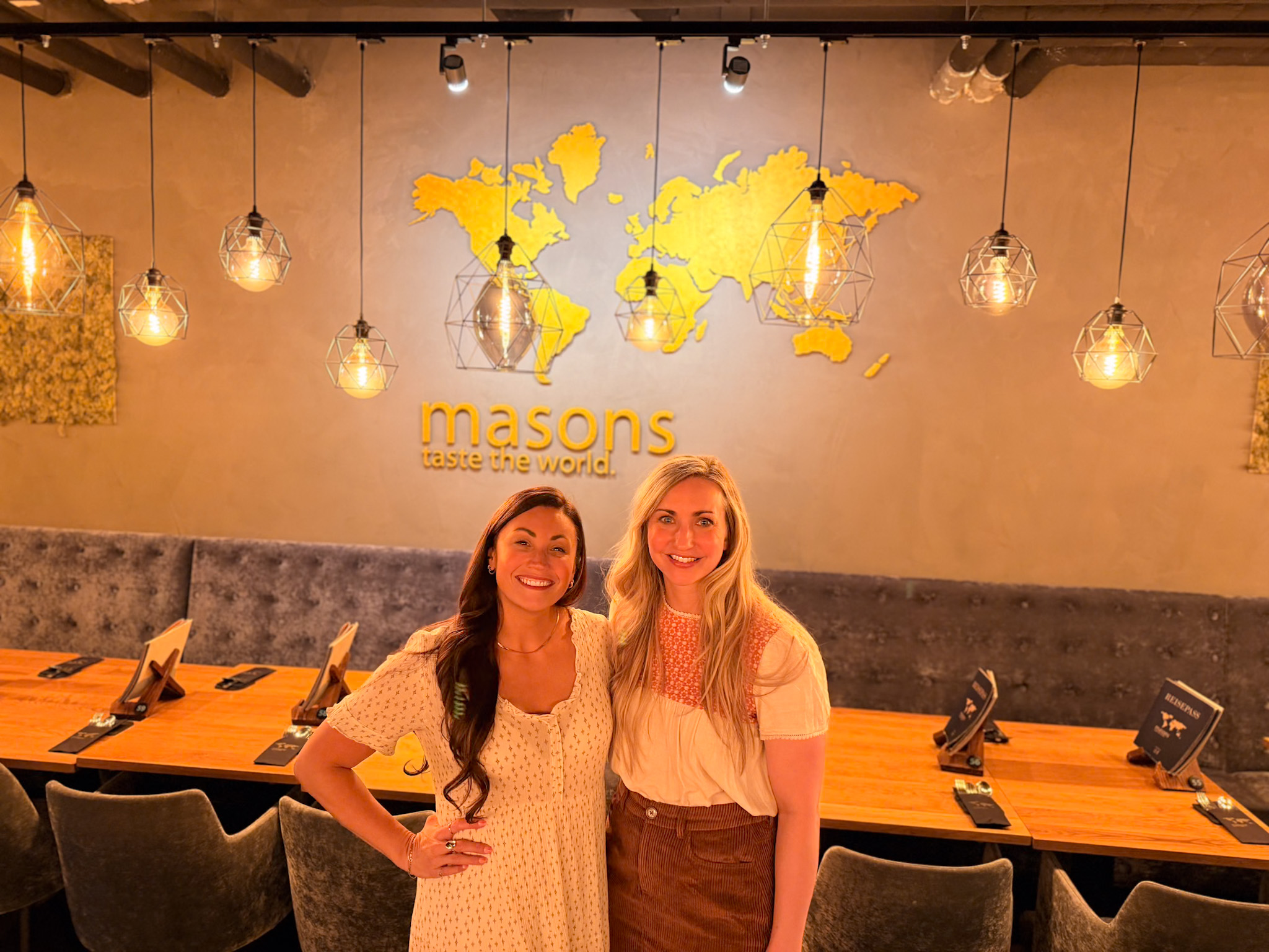 Friends sharing small plates during dinner at Masons Kaiserslautern