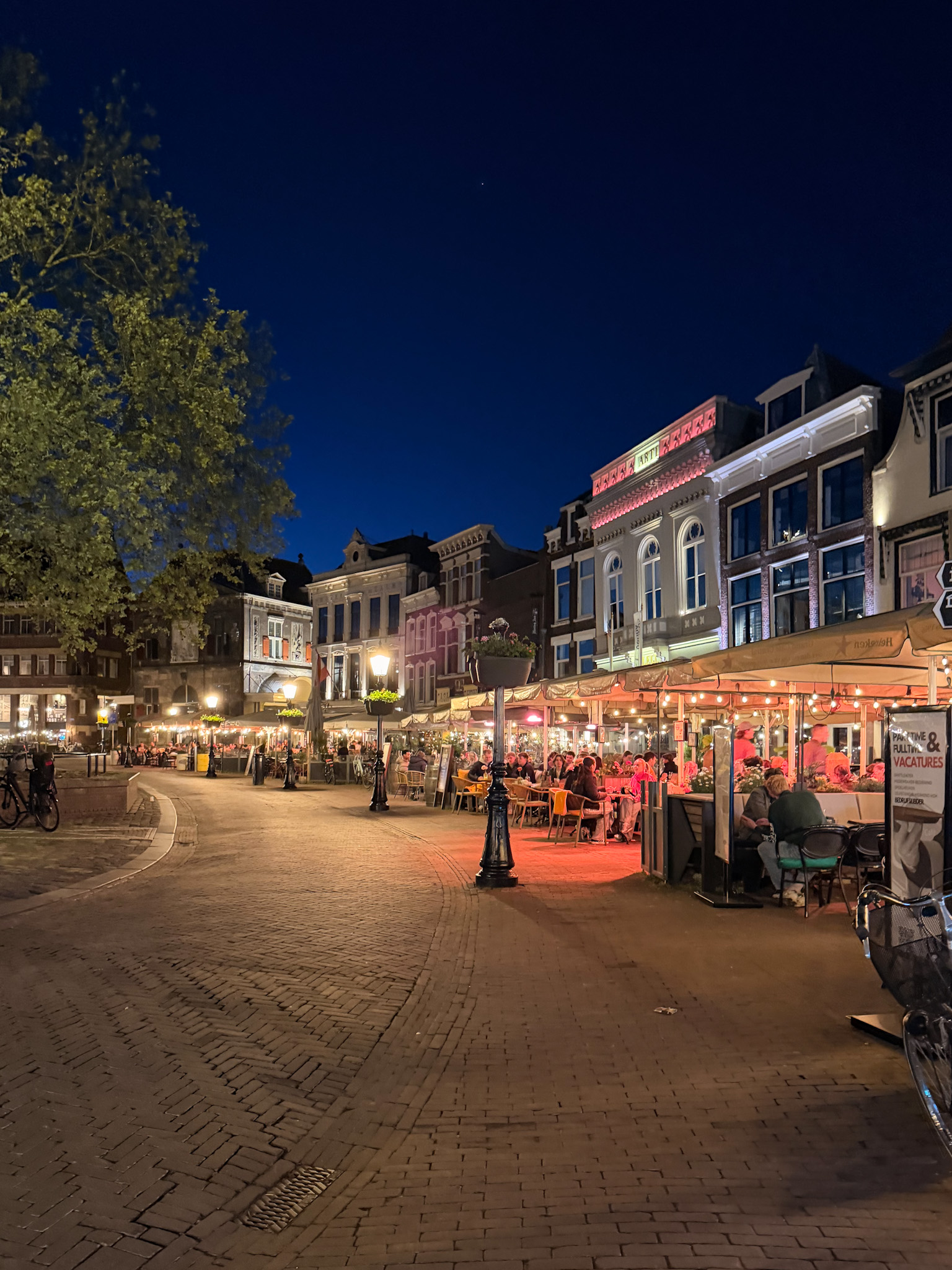 Things to do in Gouda Netherlands near the canals and old Dutch buildings at night