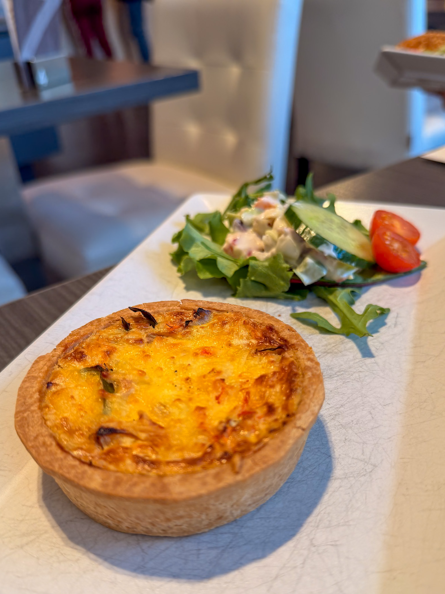 Breakfast spread at Wim Koelman Bakery Heemskerk with quiche and pastries