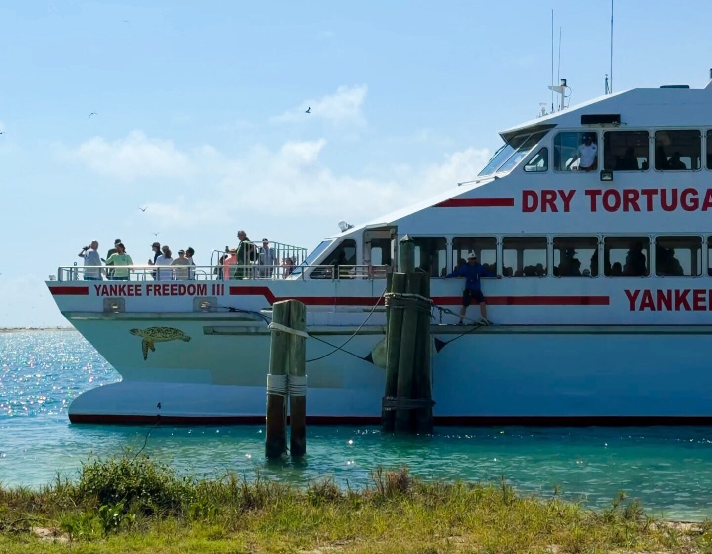 Dry Tortugas ferry vs seaplane guide showing the Yankee Freedom ferry near Fort Jefferson