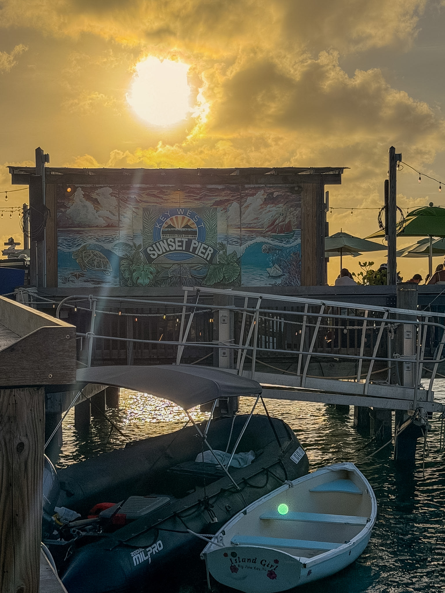 Best photo spots in Key West at Sunset Pier with boats and golden hour light