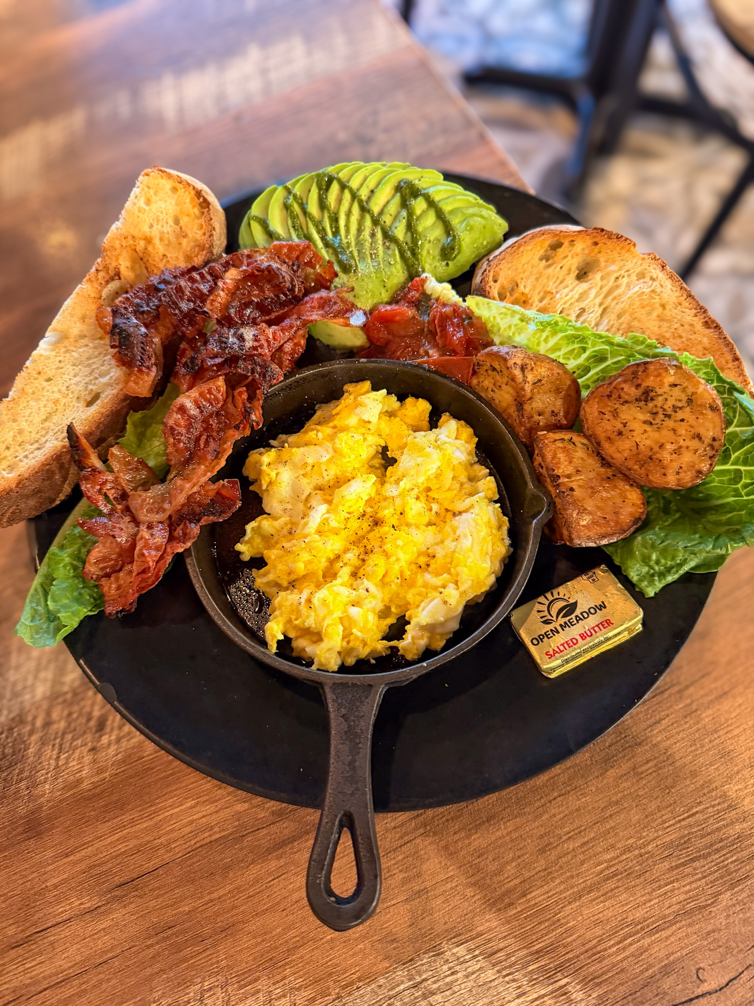 Best breakfast in Key West served with eggs, bacon, avocado, roasted potatoes, and toast