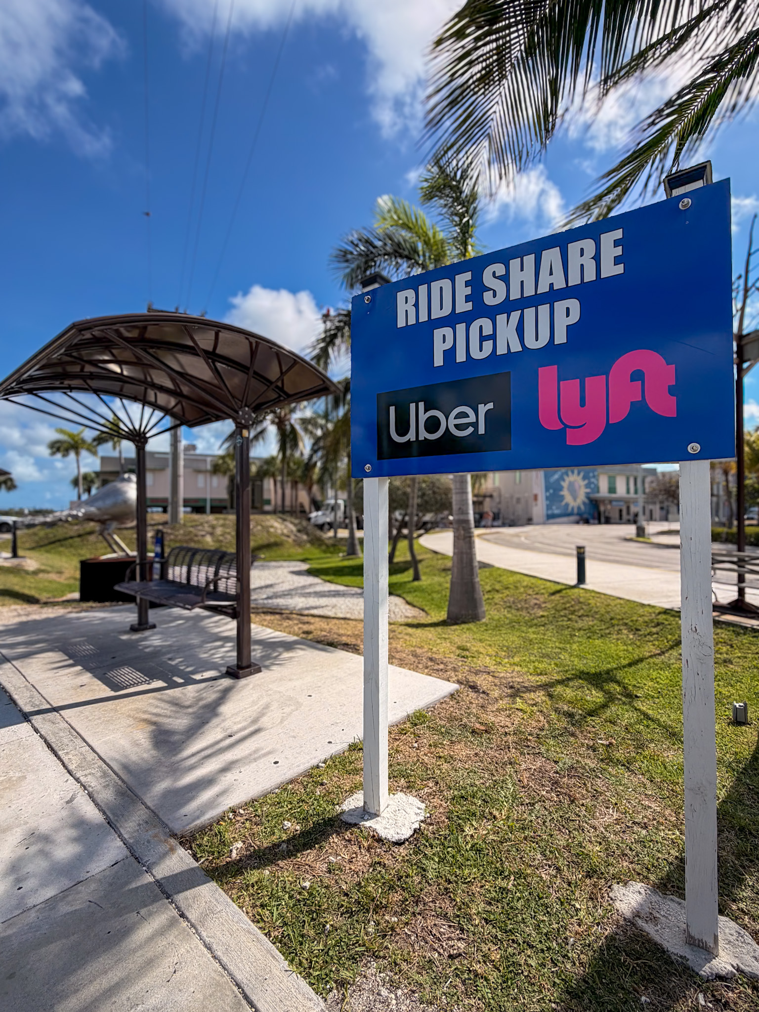 Key West airport rideshare pickup area near the blue curb