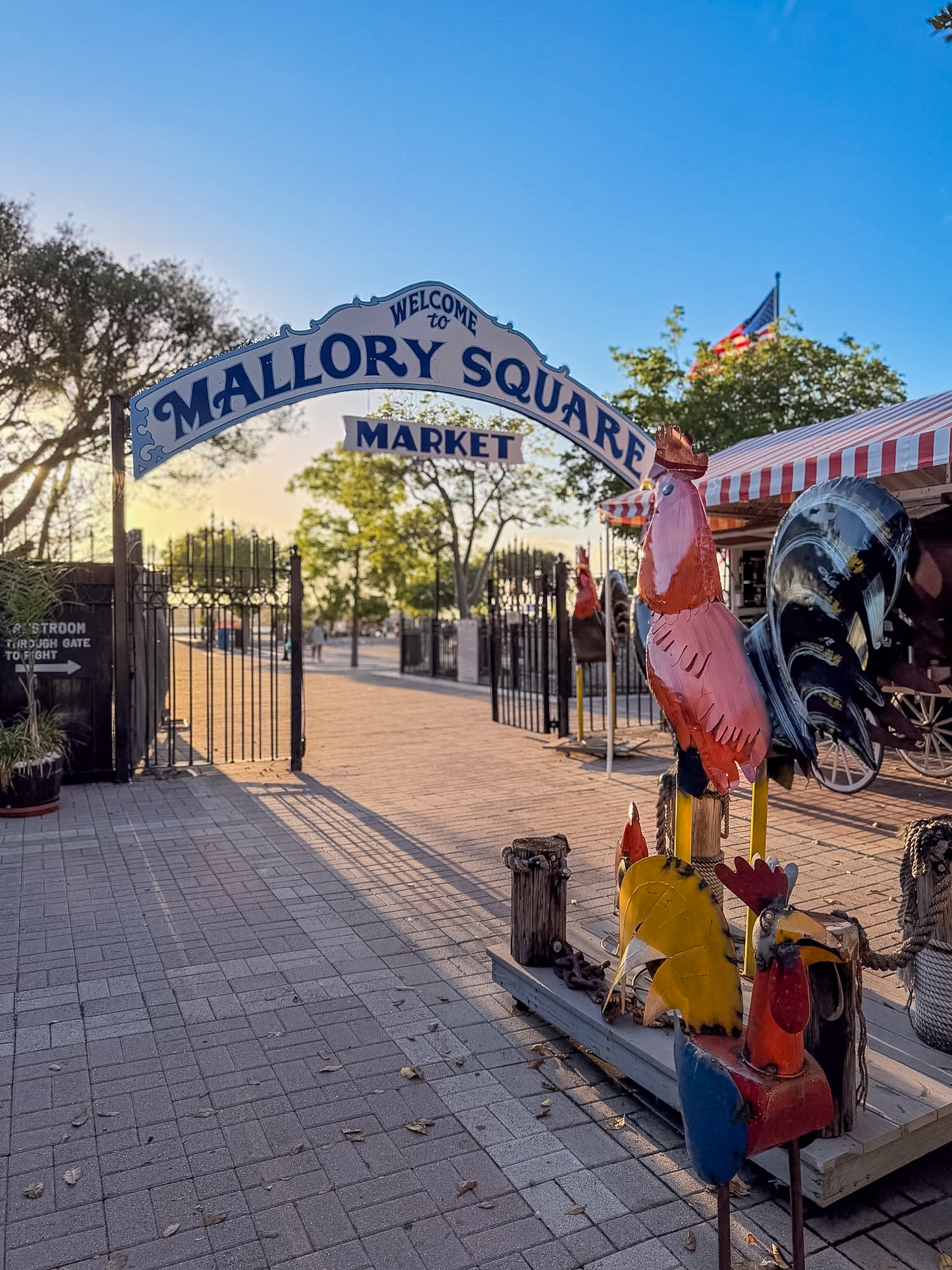 Best sunset dinner spots in Key West with boats near Mallory Square at sunset