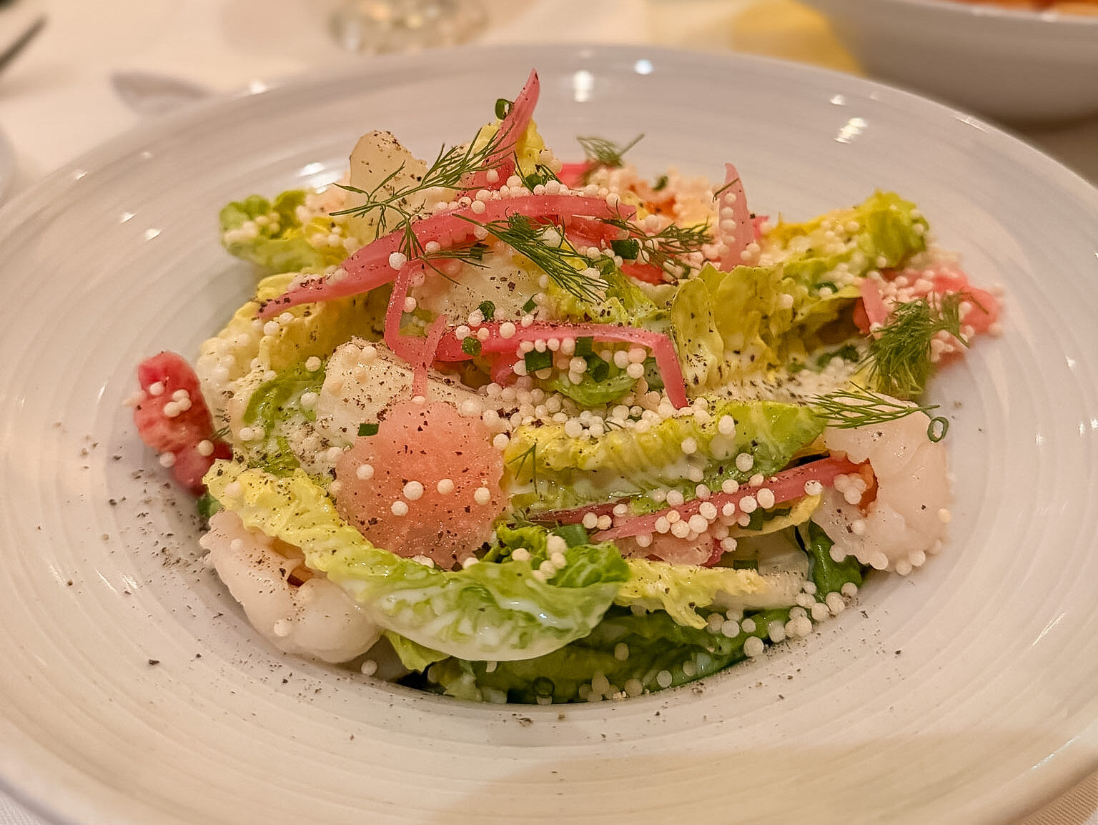 Baby Gem Lettuce salad at Café Marquesa Key West with lychee, puffed rice, and coconut ranch