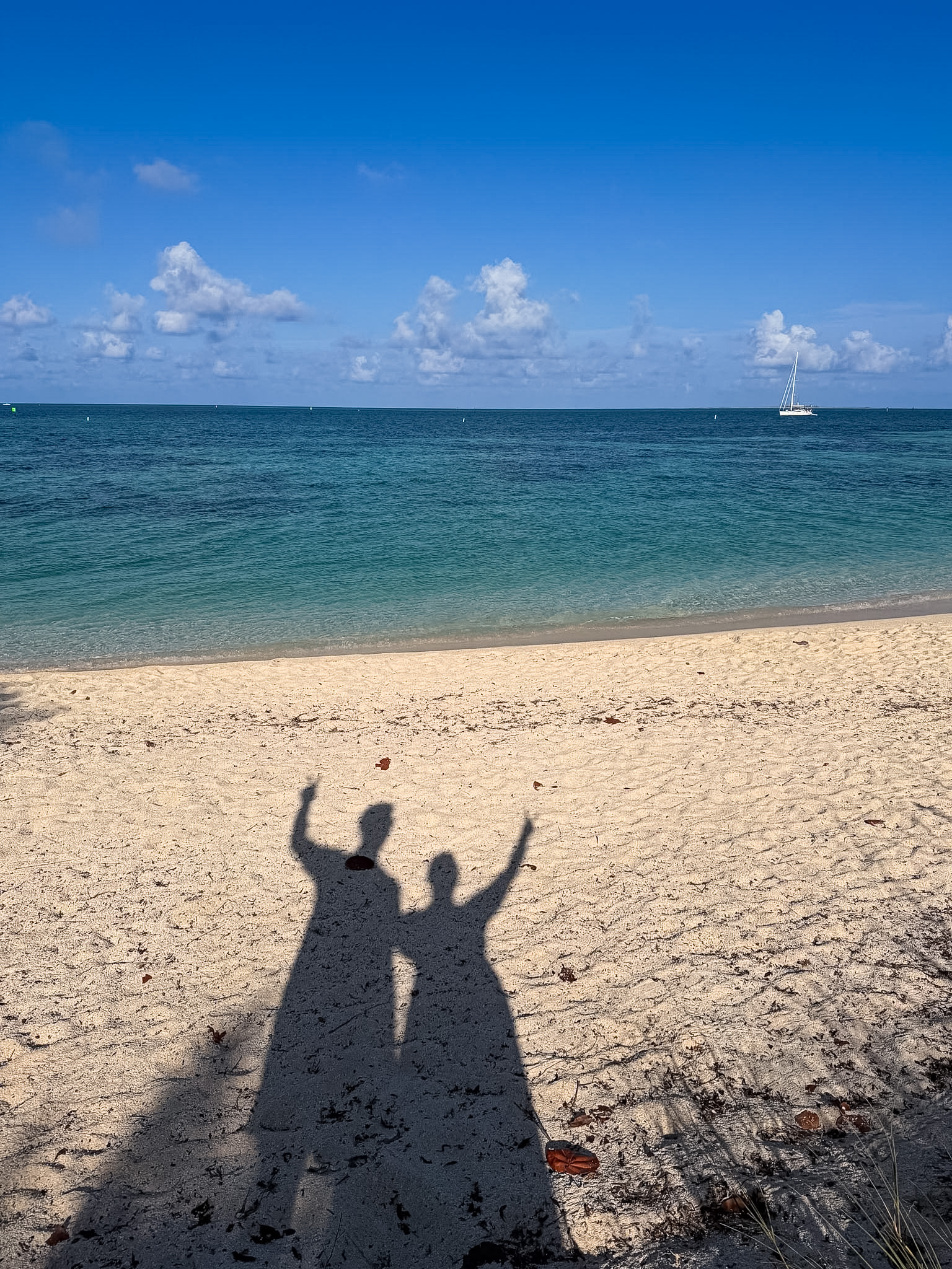 Dry Tortugas ferry vs seaplane views of islands and shallow water west of Key West