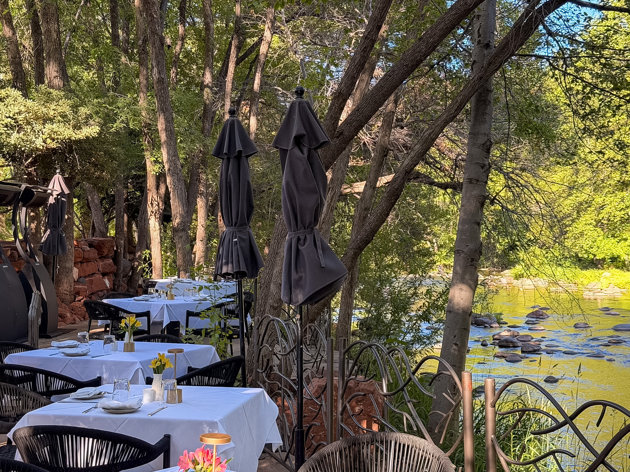Cress on Oak Creek review showing romantic outdoor dining beside Oak Creek