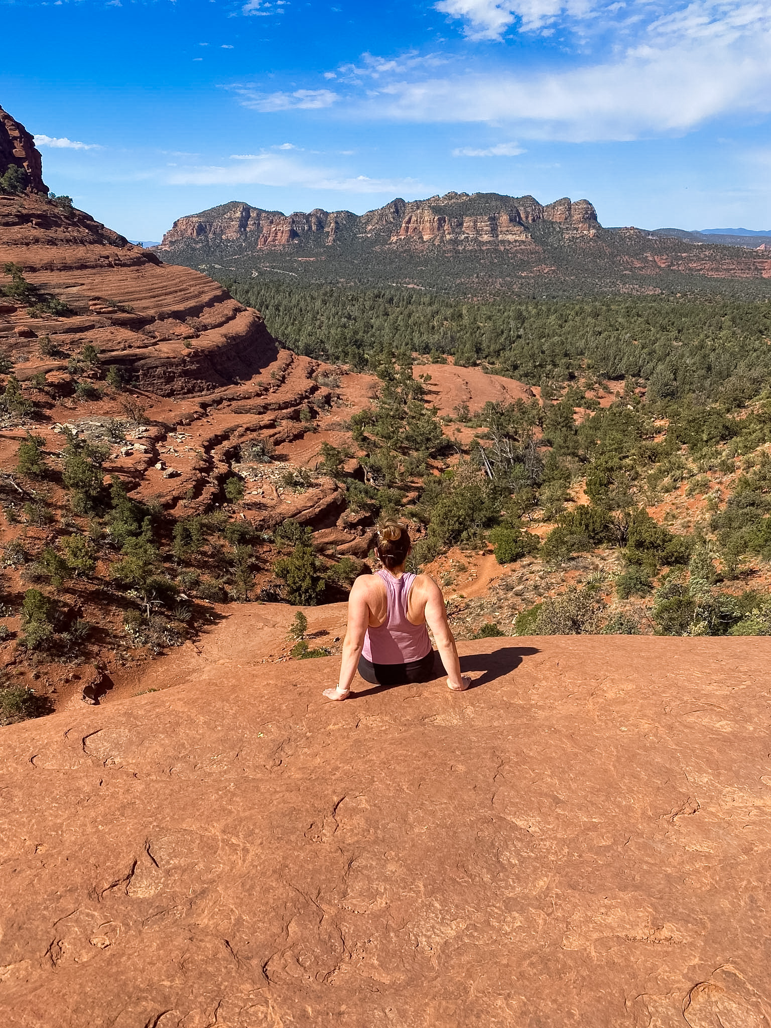 Pink Jeep Tour Sedona vehicle driving across the red rocks on the Broken Arrow Trail