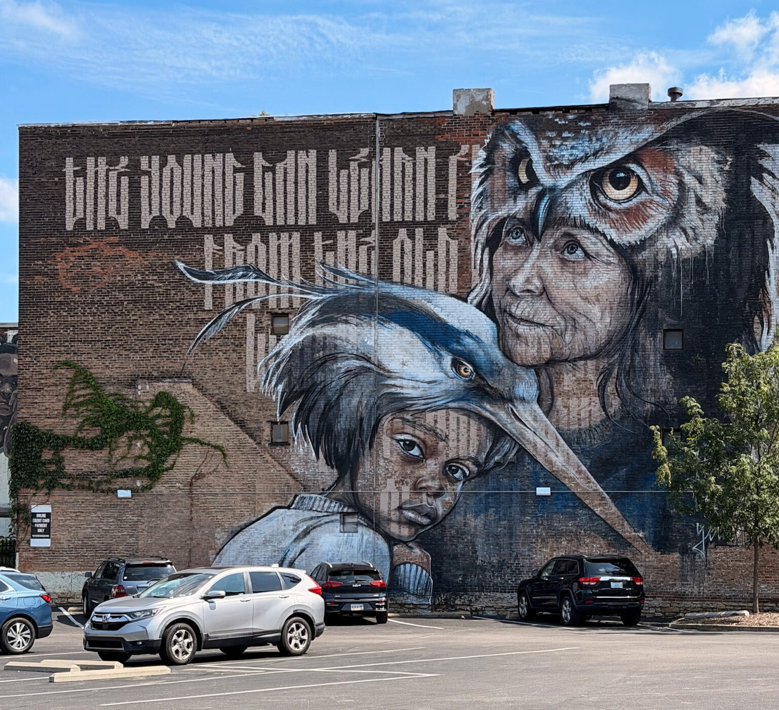 Best Cincinnati Murals including the Owl, Heron and Child mural near Elm Street and East McMicken Avenue