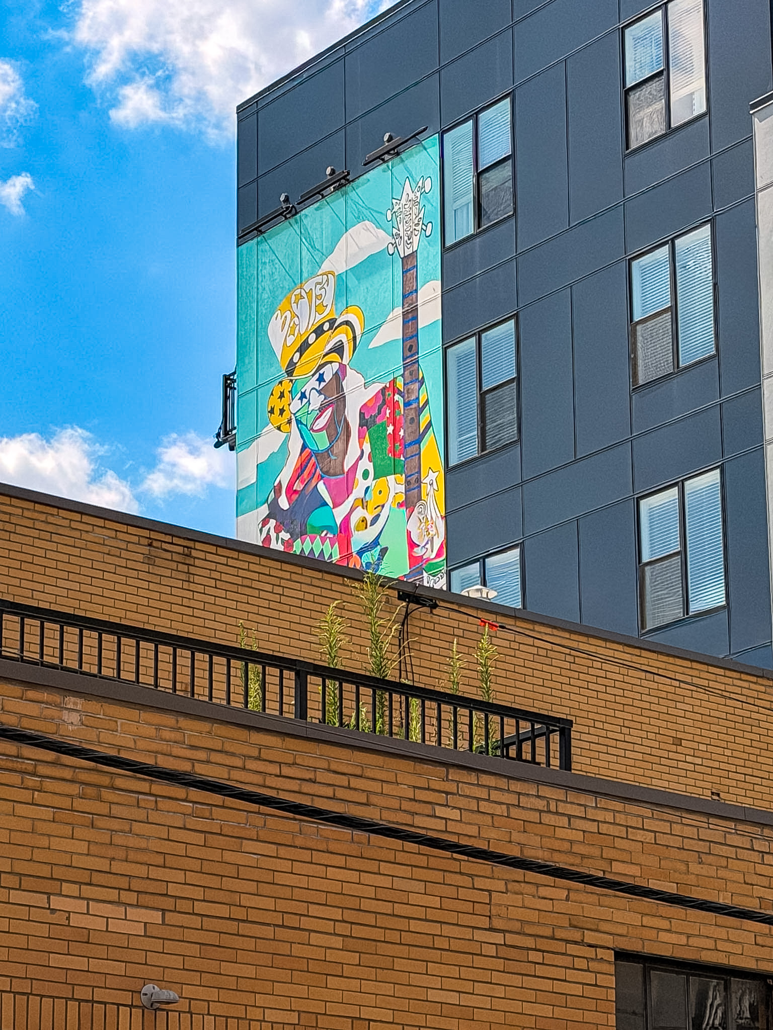 Best Cincinnati Murals including the colorful Bootsy Collins mural near Elm Street in Cincinnati