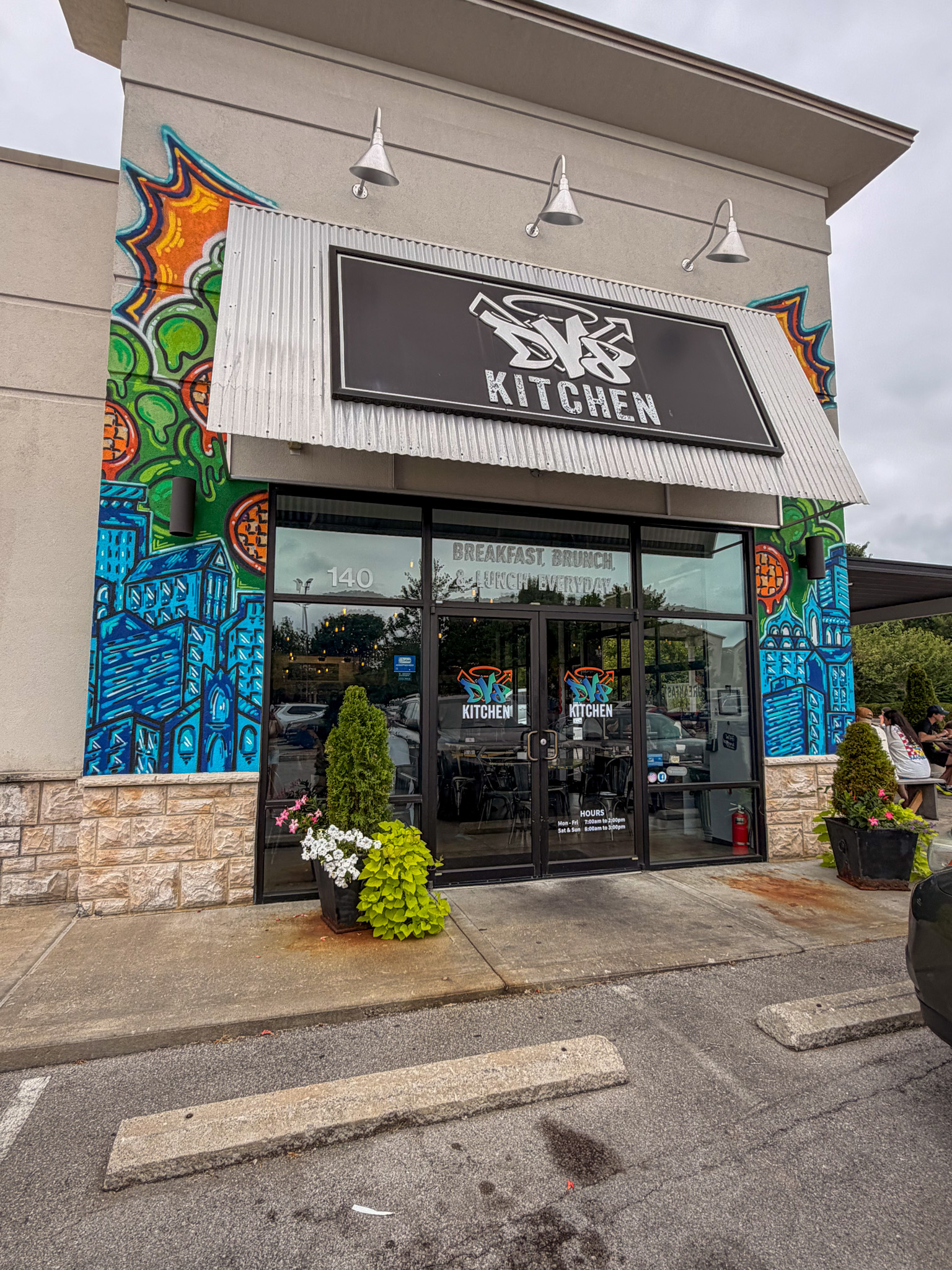 DV8 Kitchen Lexington Review showing the colorful exterior mural at the East End location