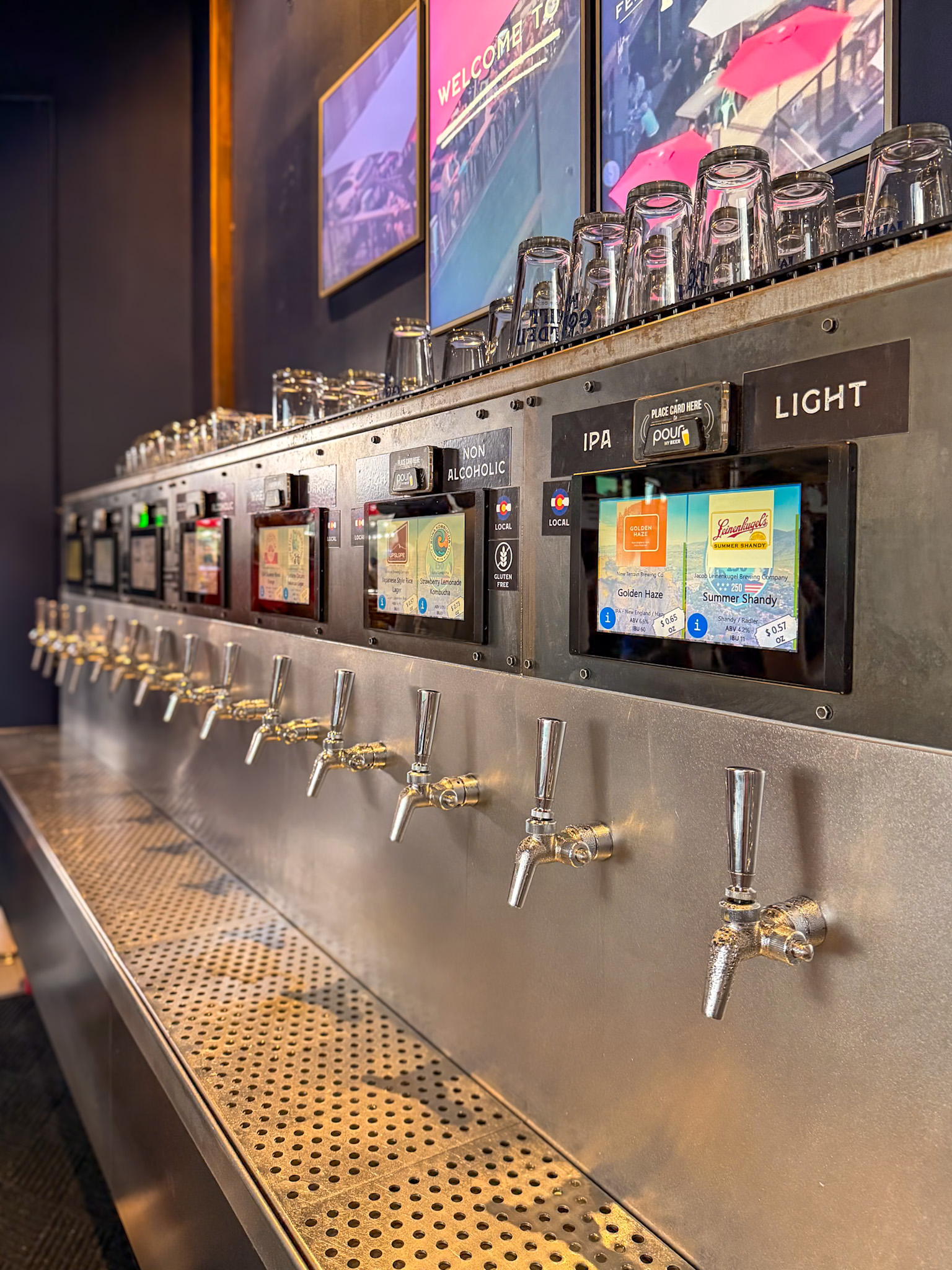 Golden Mill self-pour tap wall with rotating drink options