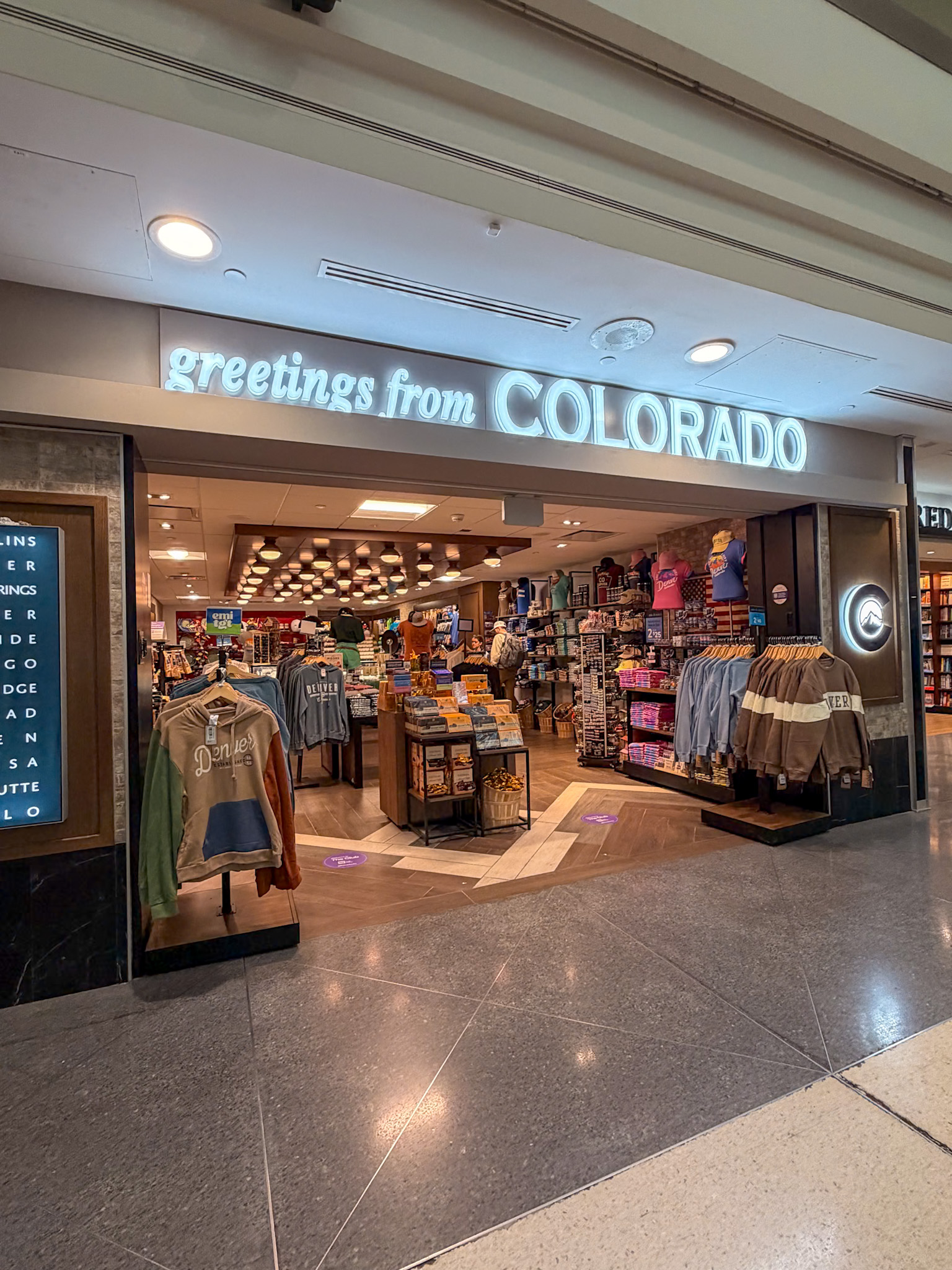 Denver Airport concourse with restaurants and shops near the gates