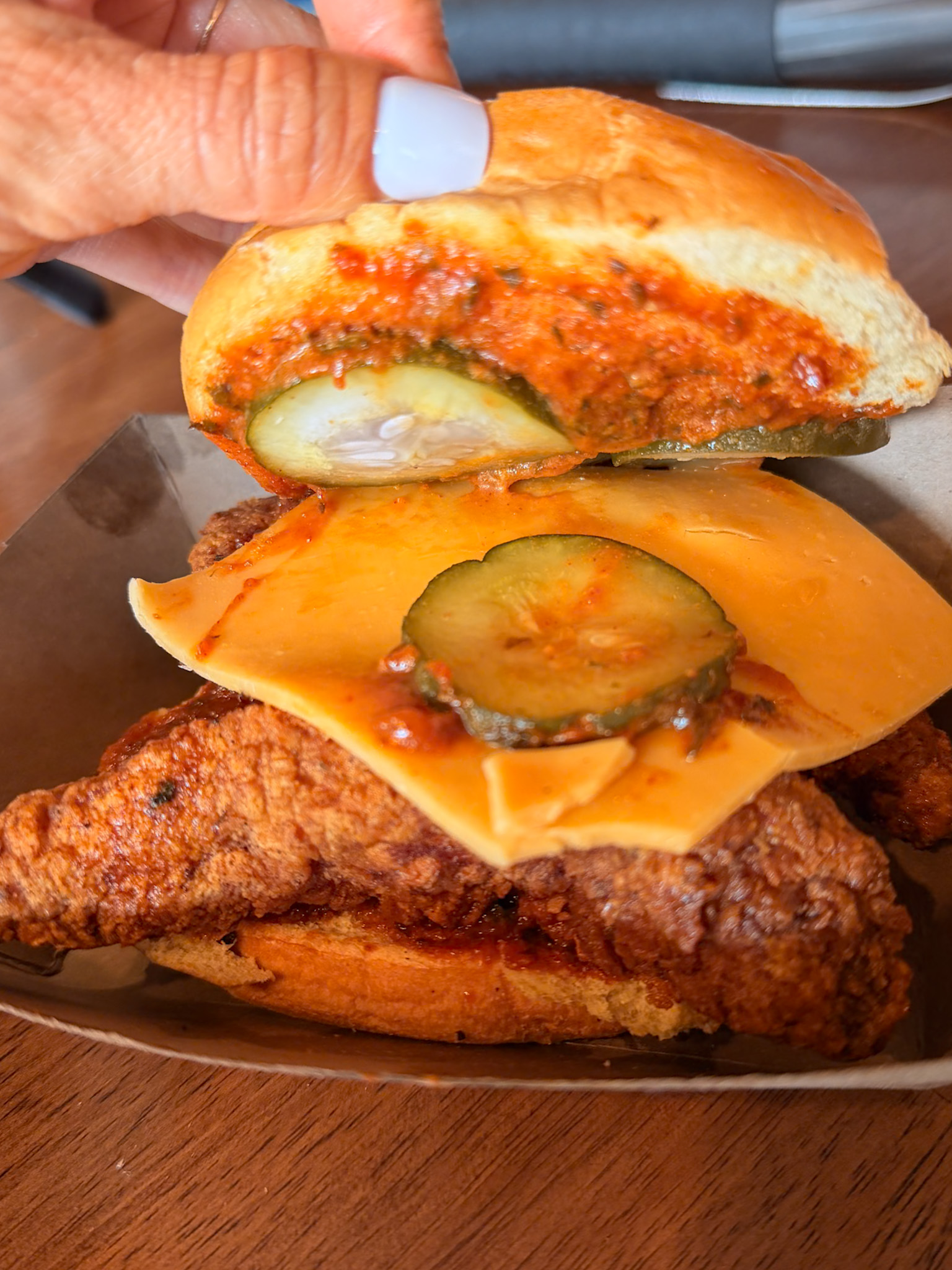 Spicy chicken sandwich from Lucky Bird for Denver Milk Market vs Denver Central Market