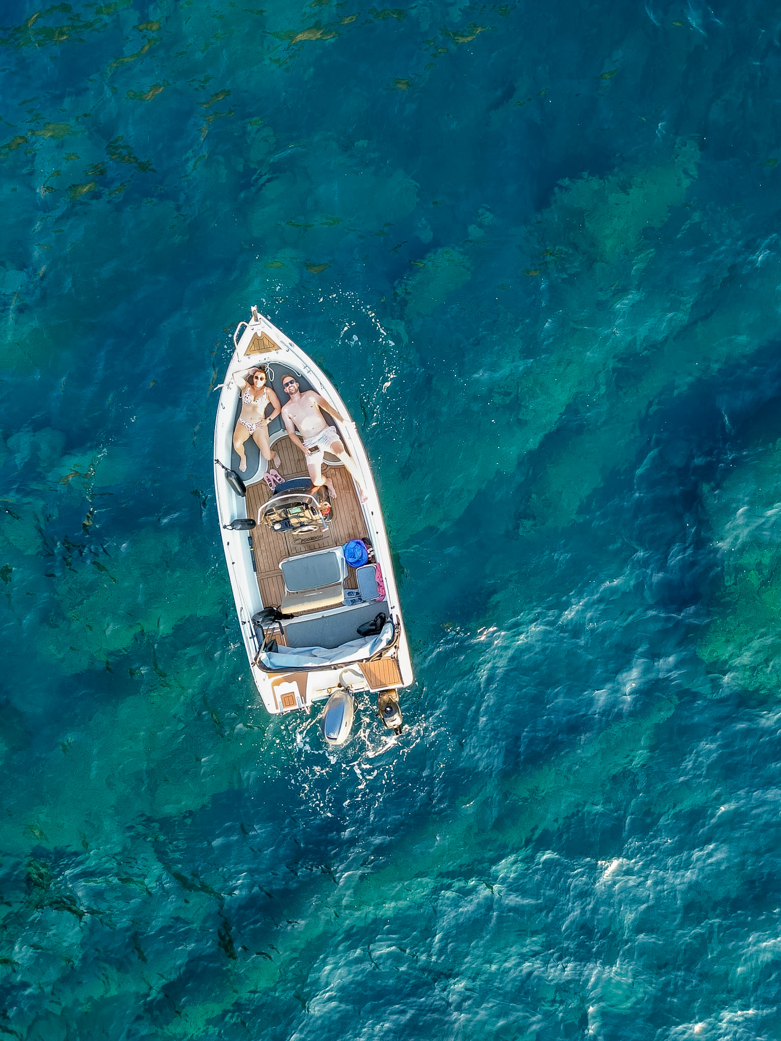 Floating in the Aegean Sea during our self-drive Santorini boat trip