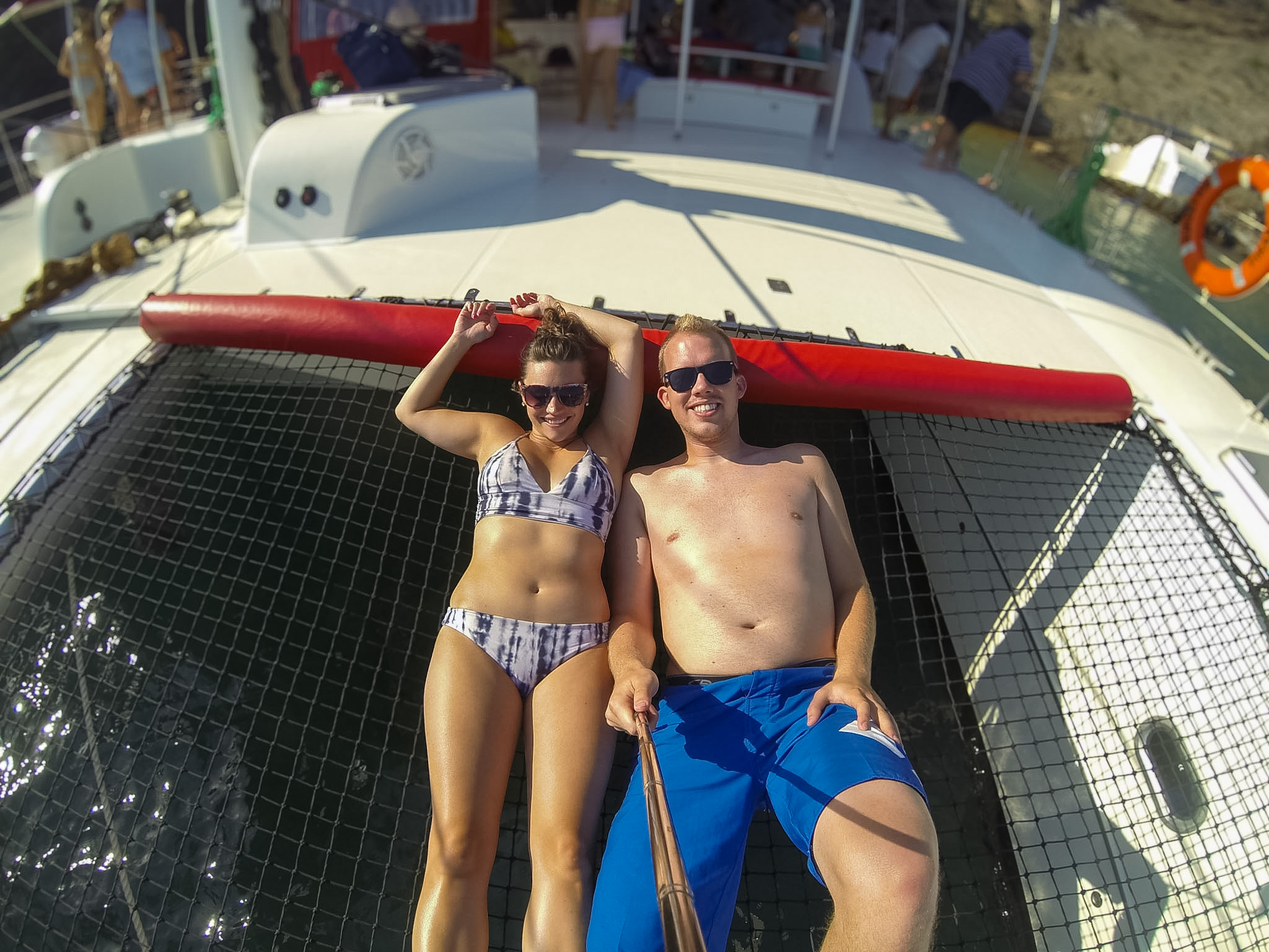Santorini catamaran cruise review showing a sailing boat in the volcanic caldera