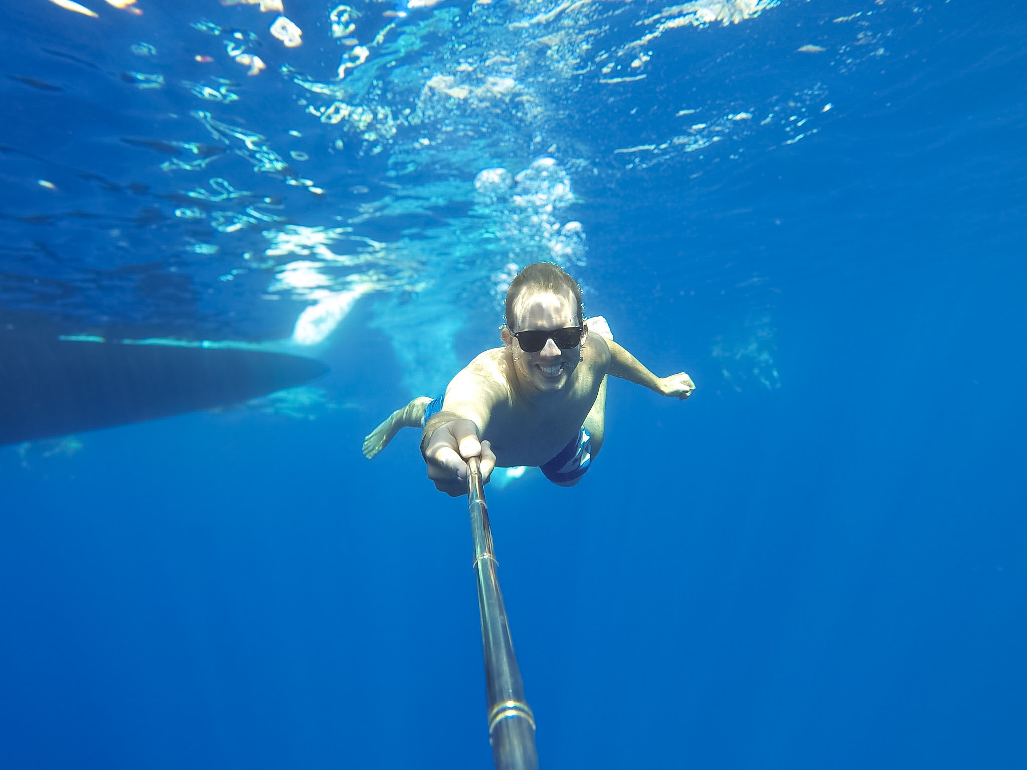 Swimming in the clear blue water near Santorini's volcanic islands