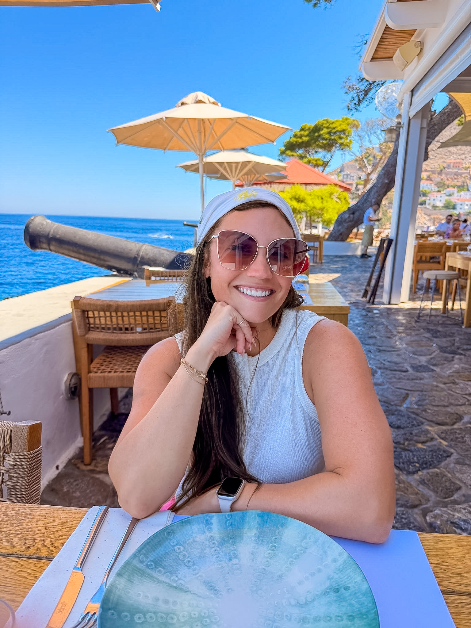 Sunset Restaurant Hydra review featuring a table with views toward Spilia Beach.