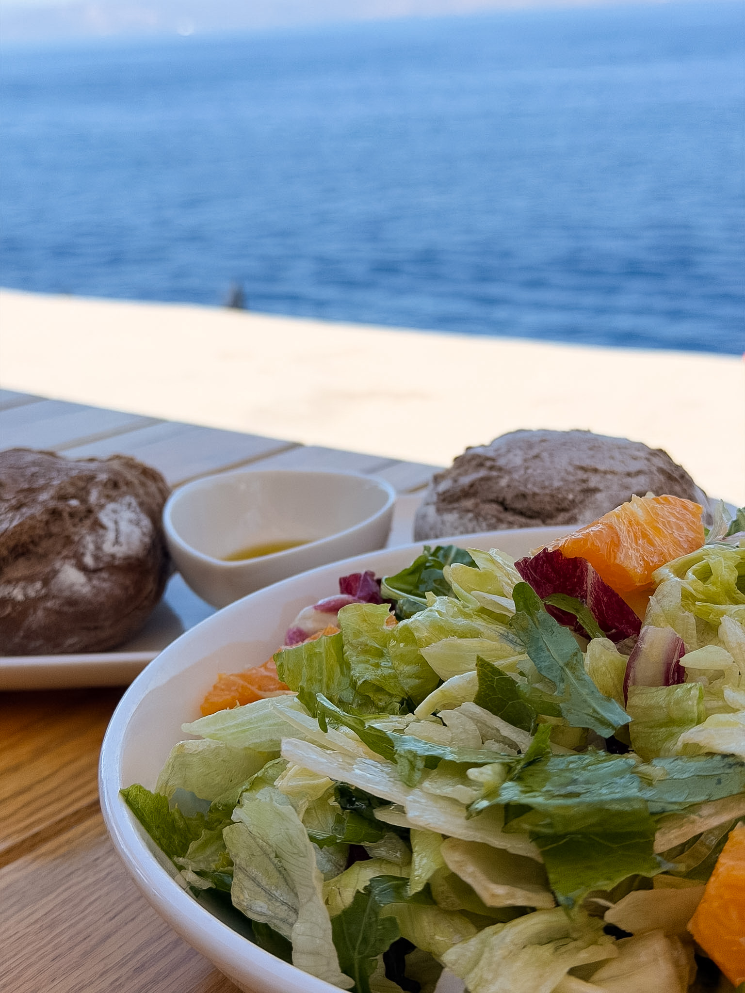 Sunset Restaurant Hydra review showing the large Sunset Salad with orange segments and mixed greens.