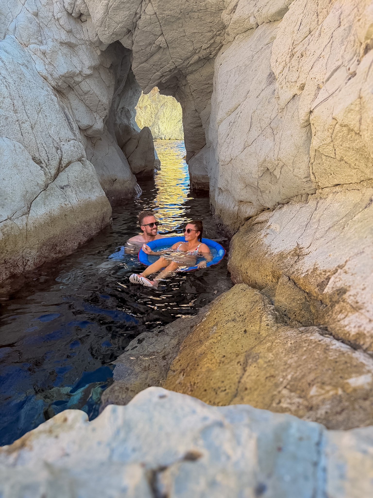 Swimming in the Aegean Sea during our self-drive Santorini boat trip