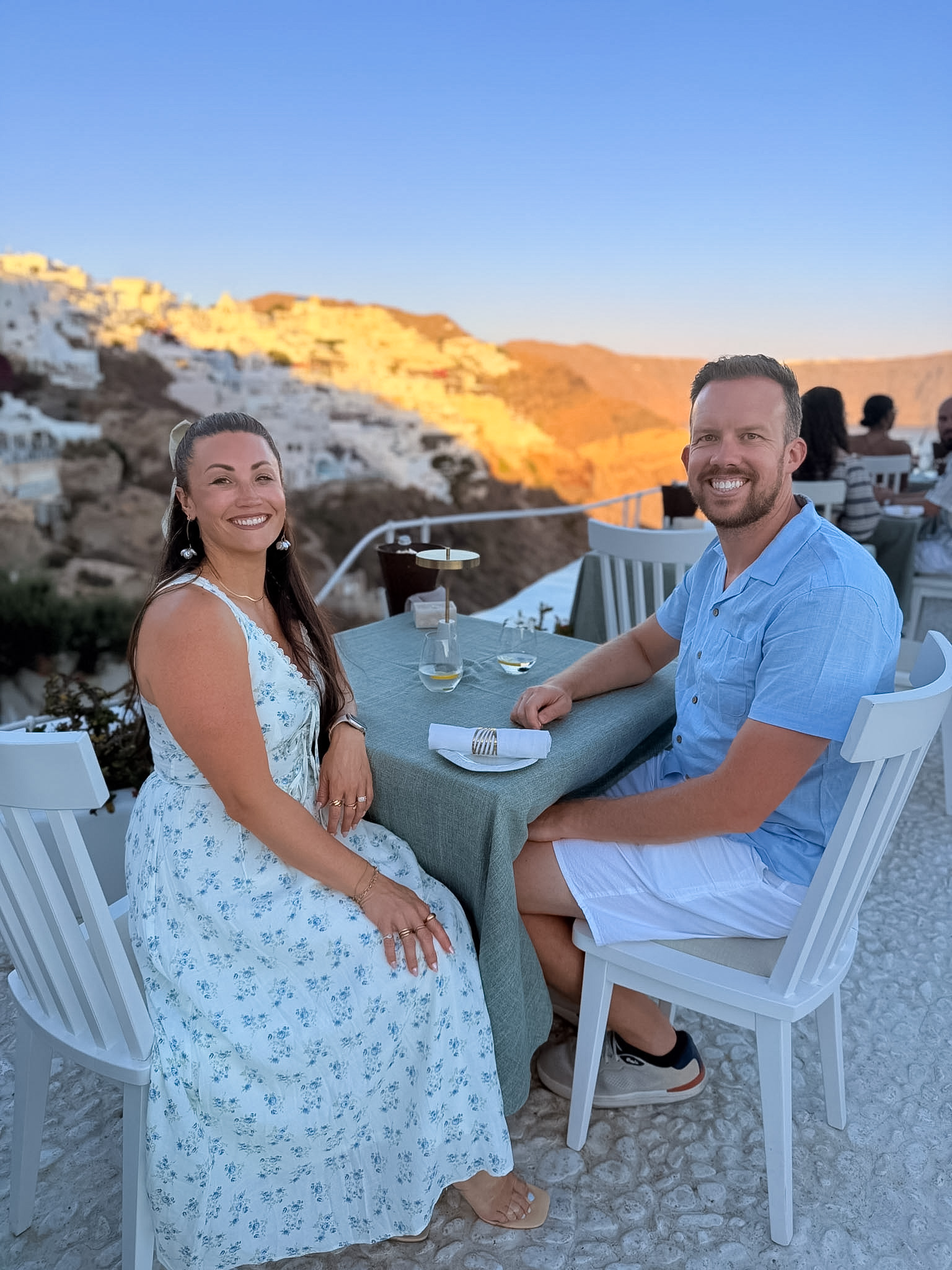 Oia village illuminated after sunset as seen from Lycabettus Restaurant