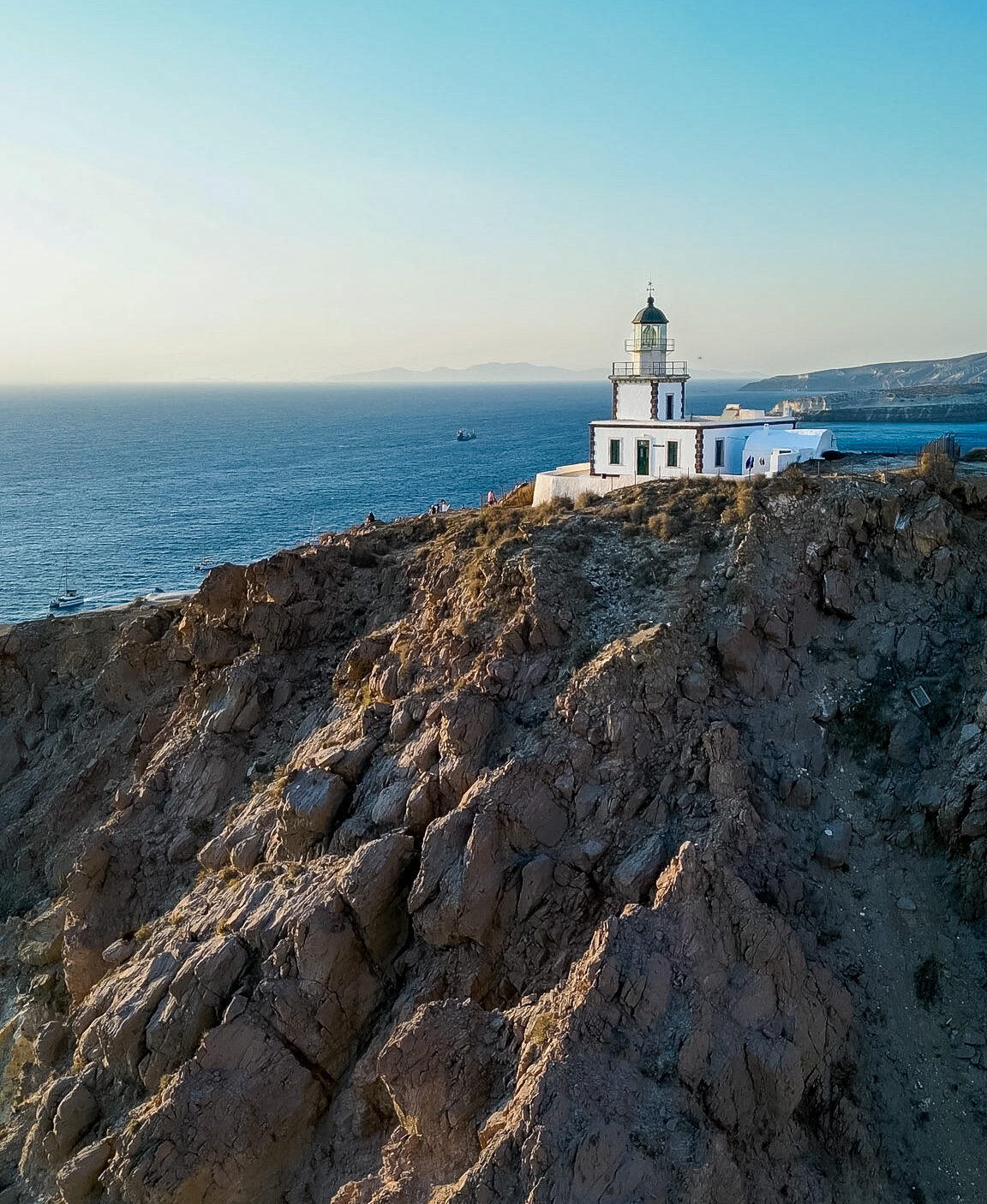 Akrotiri Lighthouse viewed from the sea during our Santorini boat rental